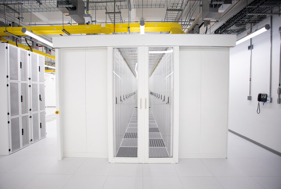 Secure white server enclosures inside SuperNova’s data hall